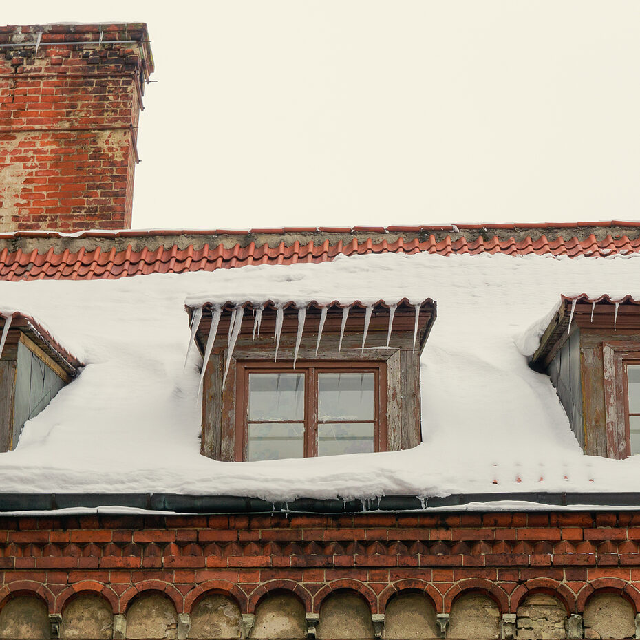 The Roof Of An Old Red Brick Church With A Chimney And Three Win Signs you need chimney repointing